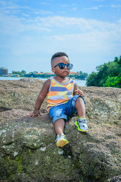Black Toddler in Sunglass Sitting on a Hilltop | Haute for the Culture